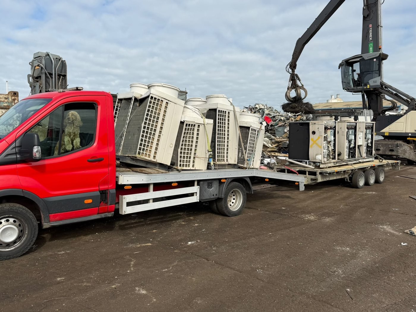 Industrial units on a truck and trailer at a recycling yard