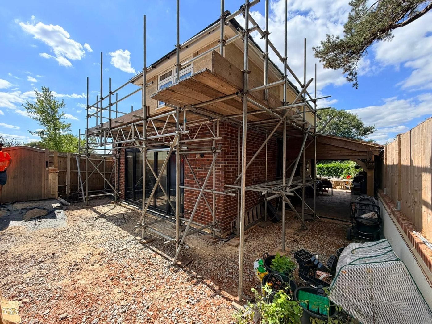 Scaffolding around the side of a house