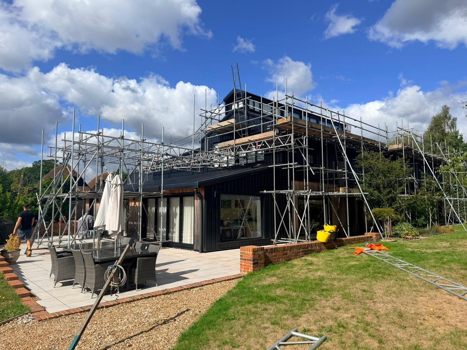 Scaffolding surrounding a large modern house