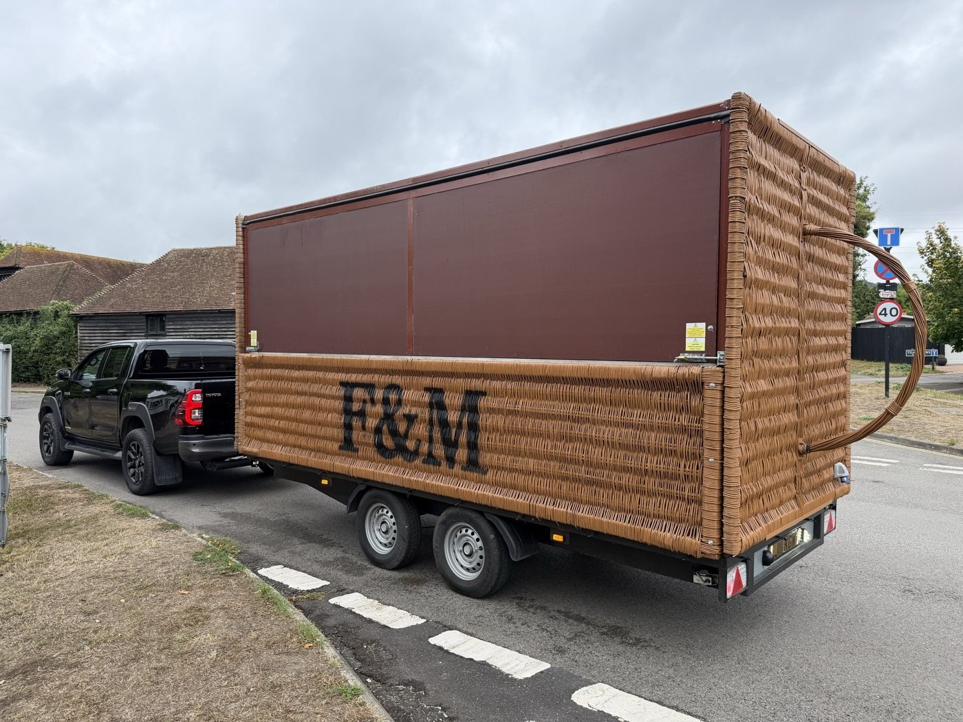 Large wooden unit carried on a trailer